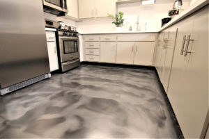 Kitchen floor with Liquid Art metallic epoxy floor coating in grey.