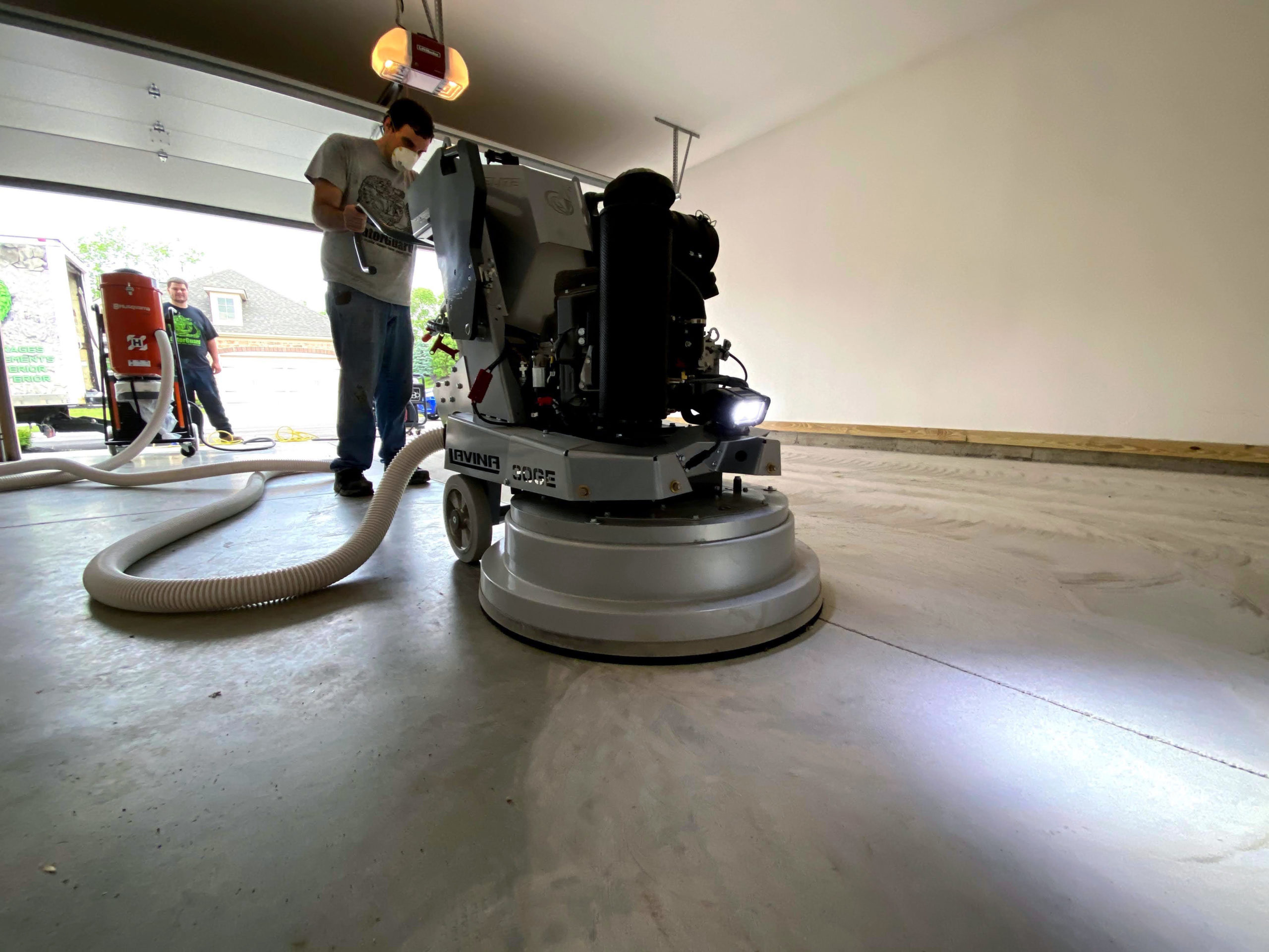 Prepping the concrete by diamond grinding it to create the proper profile for epoxy flooring