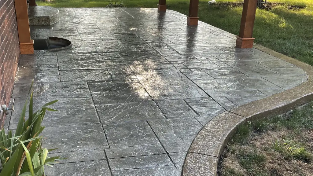 A patio coated with our proprietary stain & seal system for concrete.